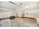 Bright garage featuring an automatic door, brick trim, and a lawn mower at 4964 Stafford Mill Rd, Liberty, NC 27298