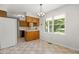Kitchen features stainless steel sink, black appliances, wood cabinets and a separate breakfast nook at 4964 Stafford Mill Rd, Liberty, NC 27298