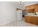 Kitchen features bright breakfast nook, white appliances and wooden cabinets at 4964 Stafford Mill Rd, Liberty, NC 27298