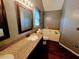 Bathroom with a large mirror and a sink with a granite countertop at 5301 Peacenest Dr, Raleigh, NC 27610