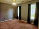 Bedroom with carpet, windows and neutral paint at 5301 Peacenest Dr, Raleigh, NC 27610