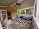 A covered patio with a table, chairs, and a view of the backyard at 5301 Peacenest Dr, Raleigh, NC 27610