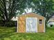 A yellow shed in the backyard at 5301 Peacenest Dr, Raleigh, NC 27610
