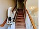 Staircase equipped with a stair lift for enhanced accessibility at 5301 Peacenest Dr, Raleigh, NC 27610