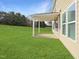A covered patio extends the living space to the outdoors, overlooking a spacious lawn perfect for entertaining at 800 Tree Green Ln, Wake Forest, NC 27587