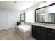 Bathroom features double sinks with granite countertops, bathtub, and a separate shower at 800 Tree Green Ln, Wake Forest, NC 27587