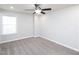 Neutral bedroom with a ceiling fan and window allowing natural light at 800 Tree Green Ln, Wake Forest, NC 27587