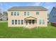 A generous backyard and covered patio enhance the appeal of this home's exterior, perfect for relaxation and outdoor enjoyment at 800 Tree Green Ln, Wake Forest, NC 27587