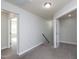 Neutral hallway with carpeted floor and access to multiple rooms at 800 Tree Green Ln, Wake Forest, NC 27587