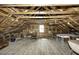 Spacious attic featuring exposed wooden beams and ample natural light, providing potential for customization at 931 Eastern Ave, Nashville, NC 27856