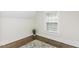 Bright attic bedroom featuring hardwood floors, neutral walls, and plenty of light at 931 Eastern Ave, Nashville, NC 27856