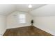 Attic bedroom featuring hardwood floors, white ceiling, and ample natural light at 931 Eastern Ave, Nashville, NC 27856