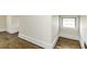 Hallway featuring light walls, elegant trim, and beautiful hardwood floors at 931 Eastern Ave, Nashville, NC 27856