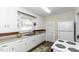 Functional kitchen with white cabinets, countertops, and updated appliances at 931 Eastern Ave, Nashville, NC 27856