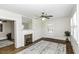 Bright living room featuring hardwood floors, fireplace, and white wood ceiling at 931 Eastern Ave, Nashville, NC 27856