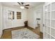 Bright living room showcasing hardwood floors, white walls, and ceiling fan at 931 Eastern Ave, Nashville, NC 27856