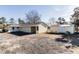 View of a spacious backyard with a shed, covered area, and ample space for outdoor activities at 9439 Clayton Blvd, Clayton, NC 27520