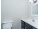 Bathroom featuring a black vanity with white countertop and new fixtures at 9439 Clayton Blvd, Clayton, NC 27520