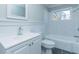 Bathroom with tiled shower, white vanity, and matching toilet at 9439 Clayton Blvd, Clayton, NC 27520