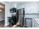 Kitchen boasting stainless steel appliances, tile backsplash, and laminate countertops at 9439 Clayton Blvd, Clayton, NC 27520