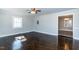 Bright living room featuring gleaming hardwood floors, ample natural light, and neutral paint at 9439 Clayton Blvd, Clayton, NC 27520
