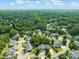 Aerial view of a neighborhood surrounded by lush green trees at 1 Lake Hill Dr, Durham, NC 27713