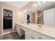 Ensuite bathroom features a double vanity, shower, and walk-in closet at 1 Lake Hill Dr, Durham, NC 27713