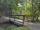 Charming community bridge over a creek, offering a serene and picturesque view of the surrounding nature at 1 Lake Hill Dr, Durham, NC 27713