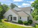 Exterior elevation of a two-story home showcasing a well-manicured lawn and landscaping at 1 Lake Hill Dr, Durham, NC 27713