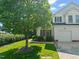 Charming two-story home featuring a manicured lawn and a single-car garage at 1 Lake Hill Dr, Durham, NC 27713