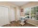 Bright kitchen nook with a moveable island cart, natural light, and multiple storage closets at 1 Lake Hill Dr, Durham, NC 27713