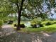 Picturesque lake view accessible via walking path, offering a tranquil escape surrounded by natural beauty at 1 Lake Hill Dr, Durham, NC 27713