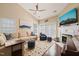 Comfortable living room with a fireplace, ceiling fan, and plenty of natural light at 1 Lake Hill Dr, Durham, NC 27713