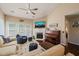 Bright living room with a cozy fireplace, piano, and comfortable seating at 1 Lake Hill Dr, Durham, NC 27713