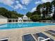 Enjoy the community pool with lap lanes and lounge chairs, perfect for relaxation and exercise on sunny days at 1 Lake Hill Dr, Durham, NC 27713