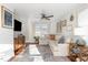 Comfortable living room with a large sectional sofa, wooden accents, and an abundance of natural light at 109 N Watauga Ave, Dunn, NC 28334