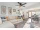 Cozy living room featuring a comfortable sectional sofa, stylish rug, and an open floor plan at 109 N Watauga Ave, Dunn, NC 28334