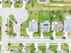 Detailed aerial view of a residential area, highlighting landscaped yards and well-maintained streets at 1124 Cedar Farm Trl, Fuquay Varina, NC 27526