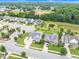 A high-angle view of a suburban neighborhood near a school and baseball field at 1124 Cedar Farm Trl, Fuquay Varina, NC 27526