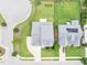 Close aerial view of two homes showcasing roofing, lawns, and driveways at 1124 Cedar Farm Trl, Fuquay Varina, NC 27526