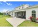 Home's backyard, featuring a screened-in porch and large grassy area at 1124 Cedar Farm Trl, Fuquay Varina, NC 27526
