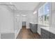 Elegant bathroom with glass shower, double vanity, and window providing natural light at 1124 Cedar Farm Trl, Fuquay Varina, NC 27526