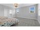 Large bedroom with plush carpet, neutral walls and trim, and double windows with natural light at 1124 Cedar Farm Trl, Fuquay Varina, NC 27526