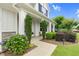 Charming home exterior with manicured landscaping and inviting walkway leading to the front porch at 1124 Cedar Farm Trl, Fuquay Varina, NC 27526
