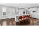 Gourmet kitchen with stainless steel appliances, quartz countertops, and a spacious island with seating at 1124 Cedar Farm Trl, Fuquay Varina, NC 27526