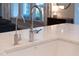 Farmhouse kitchen sink with faucet and water filter, complemented by white countertops at 1124 Cedar Farm Trl, Fuquay Varina, NC 27526