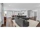 Open-concept living area with a spacious sectional sofa, seamlessly connected to the kitchen at 1124 Cedar Farm Trl, Fuquay Varina, NC 27526