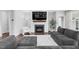 Comfortable living room with a stone fireplace and large sectional sofa at 1124 Cedar Farm Trl, Fuquay Varina, NC 27526