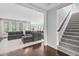 Inviting living room leading to a staircase and an open-concept kitchen with bar seating at 1124 Cedar Farm Trl, Fuquay Varina, NC 27526