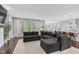 Spacious living room featuring modern decor, large windows, and an open floor plan at 1124 Cedar Farm Trl, Fuquay Varina, NC 27526